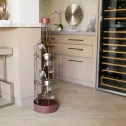 44" Iron Indoor/Outdoor Bottle Shaped Water Fountain With Tiering Wine Glasses Brown - Alpine Corporation